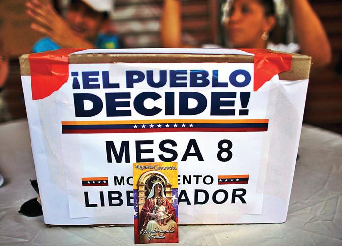 Woman killed, 3 wounded as tensions rise with Venezuela vote